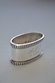 Napkin ring 
with toweres 
marks / 830 
silver, from 
year 1931. Oval 
5 x 2.8cm. 
Height 2.8cm. 
...