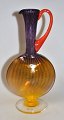 Kosta Boda 
pitcher, 20th 
century Sweden. 
Multicolored 
glass. Signed. 
H.: 27 cm. With 
...