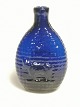 Pocket / pocket 
bottle in blue 
glass Fasblown 
with bull 
relief, on 
opposite side 
neg le and tear 
...