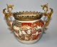Japanese 
satsuma jar 
with bronze 
mount, 19th 
century, 
signed. 
Polychrome 
decoration with 
...