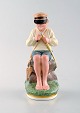Royal 
Copenhagen 
porcelain 
figurine in 
high quality 
over glaze. 
Young boy. 
Model number 
905. ...