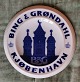 Dealer plate 
from B&G: 
Decoration with 
the text Bing & 
Grondahl 
Copenhagen and 
factory logo 
with ...