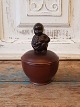 Aluminum small 
lid bowl with 
boy with grape 
bunch on the 
lid. 
Stamp: 
Copenhagen - 
Denmark - ...
