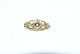 Georg Jensen 
brooch No. 267 
in 18 carat 
gold
Height 13.10 
mm
Wide 29.12 mm
Thickness 
10.24 ...