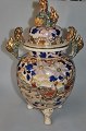 Satsuma 
earthenware 
jar, 19th 
century Japan. 
Polychrome 
decoration with 
resting 
warriors and 
...