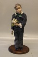 B&G 1986 Annual 
Doll "Hans"  38 
cm on wooden 
stand Boy with 
flowers
 Bing and 
Grondahl Marked 
...