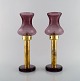 HANS-AGNE JAKOBSSON for A / B MARKARYD. A pair of tall vintage oil lamps in brass and purple art ...