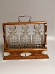 English 
Tantelus with 
three crystal 
glass decaf 
Eggs with 
silver plated 
bracket and 
lock with ...