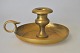 Brass 
candlestick, 
19th century 
Denmark. Round 
bowl with 
handle. H: 7 
cm. Diameter: 
13.5 cm.