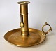 Danish brass 
candlestick, 
19th century. 
Round with 
handle. Stem 
with 
decoration. H: 
12.8 cm. ...