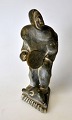 Greenlandic soapstone figure, 20th century. A man with a seal and drum. Signed. H: 13.5 ...