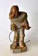 Greenlandic soapstone figure, a man with a whip, 20th century. Unsigned. H.: 11 cm.