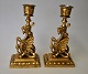 A pair of bronze candlesticks, decorated with kites, 19th century. H.: 15 cm.