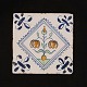 A 17th century 
polychrome 
decorated Dutch 
tile with 
flowers
Circa 1620-40
Size: 13x13cm