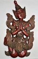Thai painted 
wooden figure 
of praying. 
20th century. 
With gilding 
and inlaid 
stones. H.: 43 
cm. ...