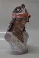 Dahl Jensen 
1362 American 
Indian bust 
(DJ) 19 cm 
Marked with the 
Royal Crown and 
DJ Copenhagen. 
...