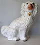 Large 
Staffordshire 
dog faience 
figure, approx. 
1840, England. 
With painting 
and gilding. 
H.: 33 ...