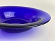 Bowl of cobalt 
blue glass 
molded in 
wooden form. 
Wear and tear. 
Diameter: 28 
centimeters. 
...