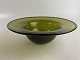 Old glass bowl 
/ glass dish of 
moss green 
glass with the 
shape of a hat. 
Wear and tear. 
...