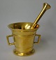Brass mortar 
with pistil and 
two handles, 
19th century. 
Unmarked. 
Height: 8.8 cm. 
Pistil length: 
...