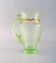 Emile Gallé 
(1846-1904). 
Early and rare 
jug in 
mouth-blown 
light green art 
glass with ...