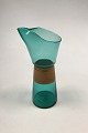 Kastrup 
Glassworks 
Opaline shape 
Green Pitcher 
with wrapped 
bamboo. Jacob 
E. Bang 1957. 
Measures ...