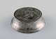 Ballin / Hertz, 
Denmark. Art 
nouveau lidded 
box in pewter 
decorated with 
young girl. Ca. 
...