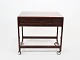 Side table on 
wheels with 
shelf of 
rosewood and of 
danish design 
from the 1960s. 
The table is in 
...