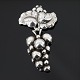 Georg Jensen 
silver 
jewellery. 
Georg Jensen; 
A Moonlight 
Blossom brooch 
made of 
sterling ...