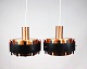 A pair of 
pendants in 
copper and 
black metal of 
danish design 
from the 1970s. 
The lamps are 
in ...
