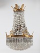 Large Empire 
style 
chandelier from 
circa 1910
Metal frame 
with a large 
number
of prisms and 
...