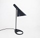 Black table 
lamp designed 
by Arne 
Jacobsen in 
1957 and 
manufactured by 
Louis Poulsen. 
The lamp ...