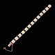Bernhard Hertz. 
Rose Gold 
plated Silver 
Daisy Bracelet 
with White 
Enamel. 11mm
Crafted by ...