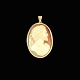 14k Gold Cameo 
Pendant.
Hand carved 
Seashell Relief 
on a 14k Gold 
Frame.
Stamped with 
585.
5 ...