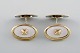 Scandinavian 
silversmith. A 
pair of gilded 
art deco 
cufflinks in 
silver (835) 
and mother of 
...