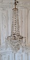 Large beautiful 
old crystal 
chandelier with 
three light 
sources. 
Appears in 
good condition. 
...