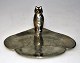 Small hammered 
bowl of pewter, 
20th century 
Denmark. Figure 
in the form of 
an owl. 
Leaf-shaped ...