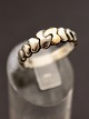 Sterling silver 
ring size 58 
with gold and 
hearts on row 
stamped SC 925s 
no. 424625