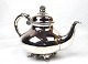 Tea pot on feet decorated with grape clusters  of hallmarked silver.
5000m2 showroom.
