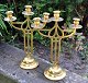 A pair of three-armed Art Nouveau candelabra in brass, c. 1900, Denmark. On round foot with ...