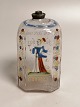 Brandy bottle 
of 
enamel-
decorated glass 
Front with 
nobleman back 
with 
inscription 
Height 13cm.