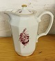 Porcelain 
chocolate jug 
with lid from 
Bing & 
Grondahl. 
Decorated with  
flowers. In 
good ...