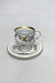 Bing & Grøndahl 
Cup and Saucer 
in gilt and 
Polychrome over 
glaze with 
floral motive. 
Under side ...