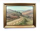 Oil painting 
with nature 
motif and 
gilded frame 
signed Jørgen 
Eising 1937.
85 x 75 cm.