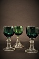 Old, 1800 
Century white 
wine glass with 
fine cuts in 
green color 
with clear 
foot. 
Height:13cm. 
...