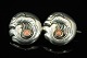 An early Georg 
Jensen 
jewellery. 
Georg Jensen; 
A silver brooch 
set with corals 
#14.  
Stamped ...