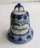 Porcelain bell: 
"Minde om 
Genforeningen" 
(Memory of 
Reunification) 
on one side and 
...