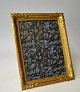 French photo 
frame in brass, 
20th century. 
With rococo 
decoration. 
20.5 x 23.5 cm.
Very nice 
copy.
