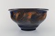Kähler, 
Denmark. Bowl 
in glazed 
stoneware. 
Orange foliage 
on blue 
background. 
1930 / ...