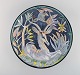 Tilgmans, Sweden. Large unique circular bowl / dish in glazed ceramics with 
antelope and monkey. Dated 1957.
